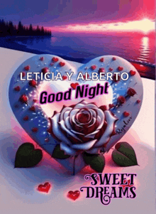 a heart shaped pillow with a rose and the words good night sweet dreams on it