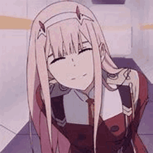 zero two from darling in the franxx is a pink haired anime girl with horns and a red dress .