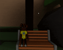 a person in a spongebob shirt sits on a bench