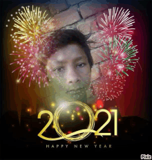 a picture of a boy with fireworks in the background and the words happy new year 2021