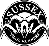 a logo for sussex trail runners with a skull