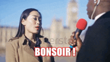 a woman is talking into a microphone and the word bonsoir is visible