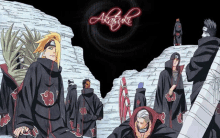 a group of anime characters are standing in front of a wall with the word akatsuki written on it