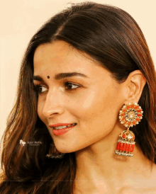 a close up of a woman 's face with a photo by aajy patil