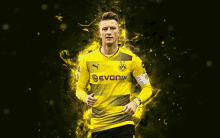 a soccer player wearing a yellow and black jersey that says evonik on it