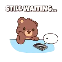 a teddy bear is sitting at a table with a cell phone and a speech bubble that reads still waiting