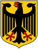 a coat of arms with a black eagle on a yellow background