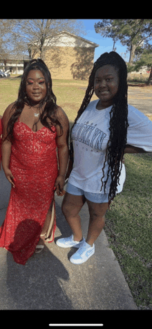 two women standing next to each other one wearing a t-shirt that says ' brooklyn '