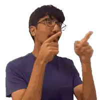 a man wearing glasses and a blue shirt is pointing