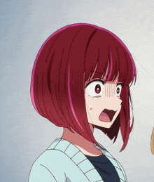 a close up of a girl with red hair and a surprised look on her face