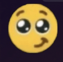 a close up of a smiley face with big eyes and a slight smile .
