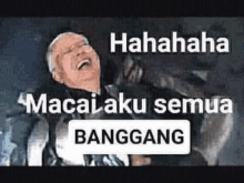 a man is laughing with the words ' hahahaha macai aku semua bangga ' on the bottom of the image .