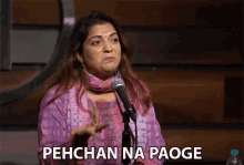 a woman speaking into a microphone with the words " pehchan na paoge " written below her