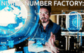 a man stands in front of a screen that says " nubby number factory " on it