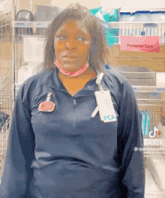 a woman wearing a mask and a name tag that says pca on it