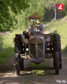 a man in a cowboy hat is driving a tractor on a dirt road with the number 4 in the background