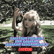 a woman with blonde hair is standing in front of a tree with the words rah ikon premium dan pasaran ledakan kemenangan on the bottom
