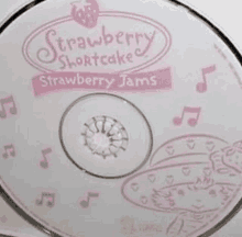 a close up of a strawberry shortcake cd with a strawberry on it .