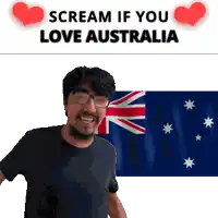 a man with glasses stands in front of a flag with the words scream if you love australia