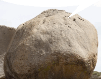 a large rock with a speech bubble pointing at it