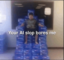 a boy is sitting on a stack of pepsi boxes .