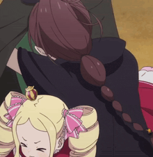 a girl with a pink bow on her hair is hugging a man