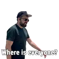 a man wearing a baseball cap and a black shirt is asking where is everyone
