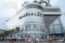 a poster for the pattaya marathon 2022 shows a large terminal 21 building