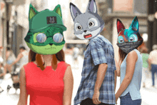 a man and two women are walking down a street with cartoon animals on their faces