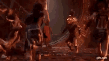 a group of people are fighting each other in a video game in a cave .