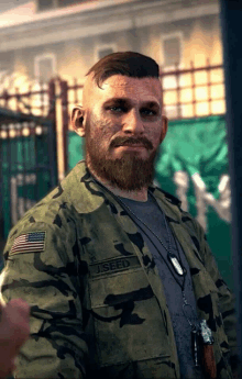 a man with a beard is wearing a military uniform with the name i seed on the front