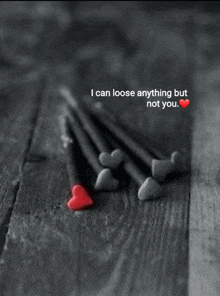 a black and white photo with a red heart and the words " i can loose anything but not you " on the bottom