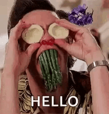 a man is eating vegetables and making a funny face with vegetables in his mouth .