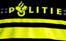 a black and yellow striped shirt that says politie