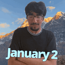 a man wearing glasses and a black shirt with the words january 2 on the bottom