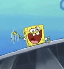 spongebob squarepants is holding a key in his hand and smiling while standing on a ledge .