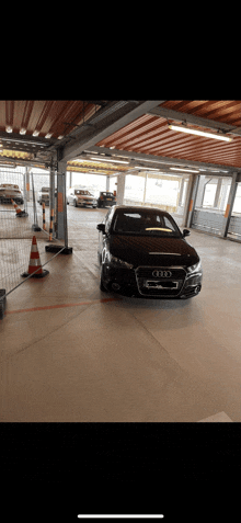 an audi is parked in a parking garage