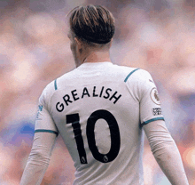 a soccer player wearing a white jersey with the number 10 on it