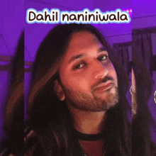 a man with long hair and a beard has the words ako na kaya above his face