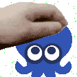 a pixel art of a hand touching a blue octopus with white eyes .