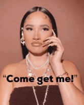 a woman talking on a cell phone with the words " come get me " behind her