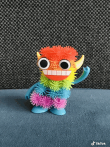 a colorful toy that says tiktok on the bottom right