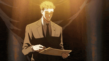 a man in a suit and tie holds a piece of paper in his hands