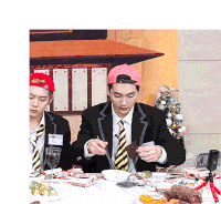 a man wearing a pink hat is sitting at a table eating food