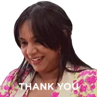 a woman in a pink and green floral shirt is smiling and says thank you