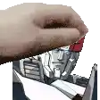 a close up of a person 's hand holding a robot 's head .