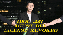 a man in a suit is being interviewed with the words idol 227 agust due license revoked