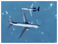a plane is flying in the sky with the letters ncs on the tail