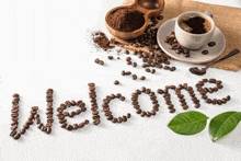 the word welcome is made out of coffee beans on a table