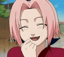 a close up of a cartoon girl with pink hair smiling and holding her fist to her mouth .